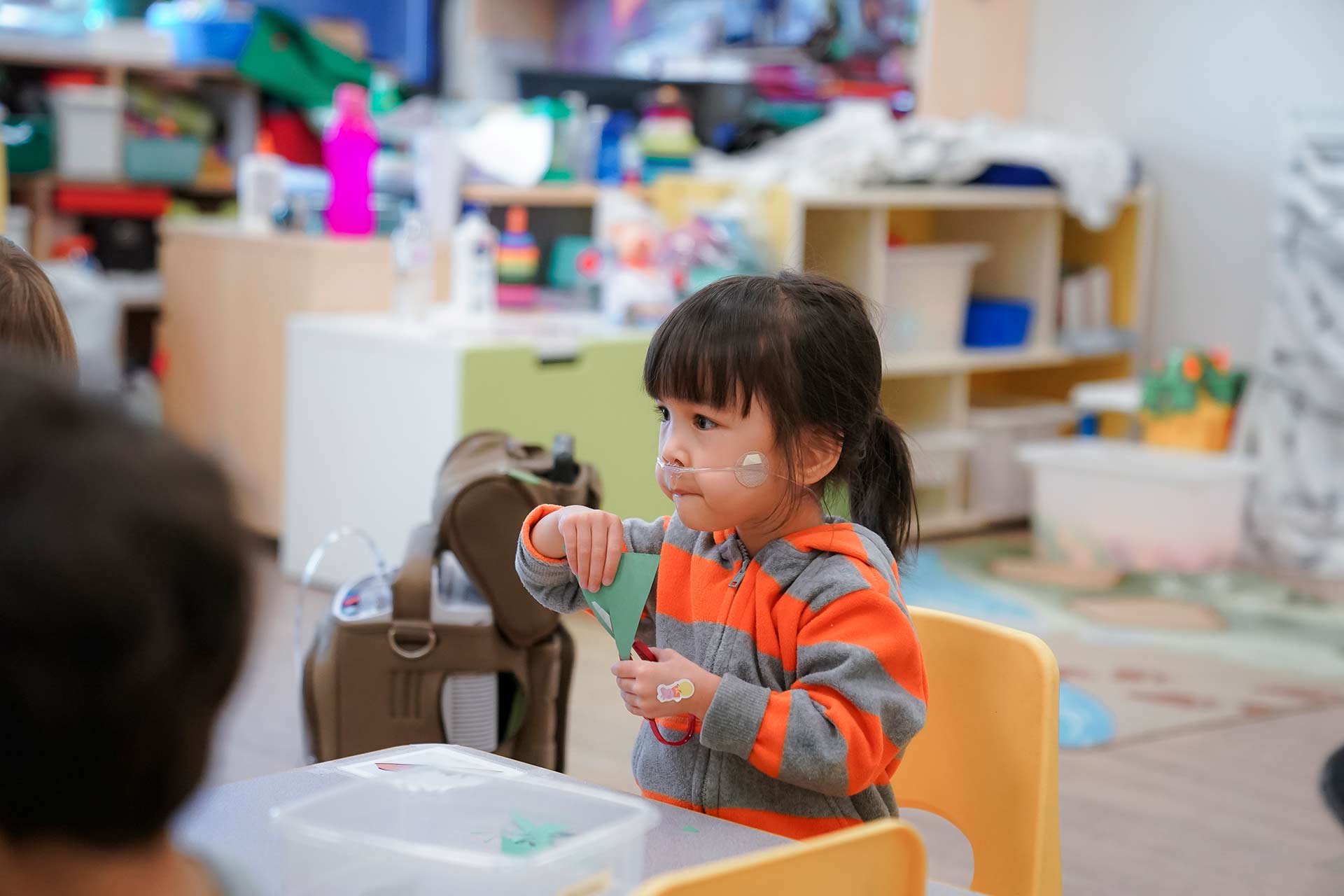 Special Needs Child Using Scissors